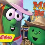 Two animated green veggie characters wearing cowboy hats stand in front of a western town backdrop, with the VeggieTales logo and the title 'MOE and the Big Exit' visible in the upper right.