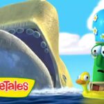 Two VeggieTales characters ride in a yellow raft on bright blue water, a tall green veggie wearing glasses beside a small yellow duck, with the VeggieTales logo in the corner.