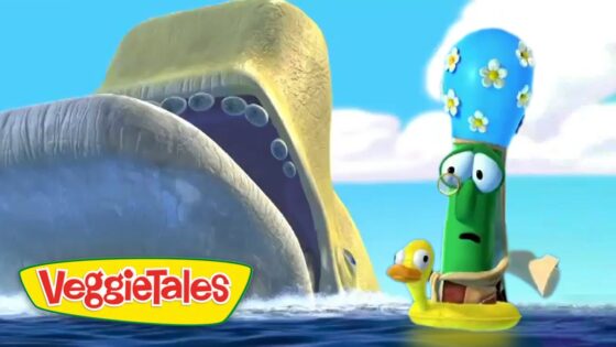 Two VeggieTales characters ride in a yellow raft on bright blue water, a tall green veggie wearing glasses beside a small yellow duck, with the VeggieTales logo in the corner.
