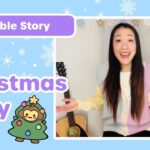 Thumbnail for a kids' Bible story video: 'The Christmas Story' with a smiling woman presenter, a guitar, and a Christmas tree in the background.