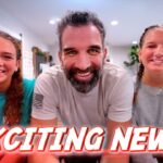 Three people smile at the camera in a bright room with a bold red 'EXCITING NEWS!' banner across the bottom, as a video thumbnail.