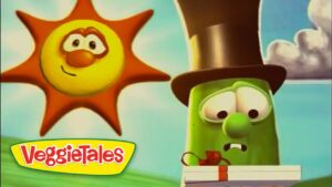 A cheerful sun beside a puzzled green cucumber wearing a top hat, with a book in front, in a VeggieTales scene.
