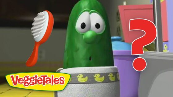 VeggieTales pickle character looks surprised with a red question mark and a hairbrush nearby.