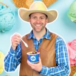Smiling man in a plaid shirt and cowboy hat holding a blue cup of ice cream with a spoon, surrounded by colorful ice cream cones and scoops in a pastel background.