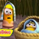 VeggieTales logo in the corner with two cartoon vegetables in the rain; one wearing a striped towel hood and the other inside a woven basket.