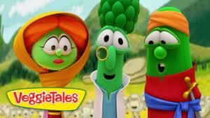 Three green veggie characters from VeggieTales stand together outdoors, with the VeggieTales logo in the corner and a colorful, friendly scene behind them.