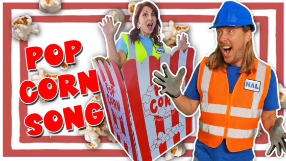 Thumbnail of a man in an orange safety vest and hard hat, a surprised woman in a safety vest, a giant popcorn box, and bold POP CORN SONG text.