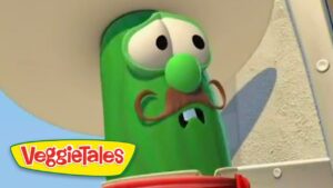 Larry the Cucumber from VeggieTales with a brown mustache and googly eyes.