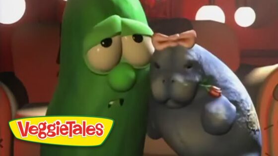 Close-up of two VeggieTales characters—a green cucumber and a gray hippo with a bow tie—nuzzling each other, with the VeggieTales logo bottom left.
