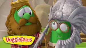 Two VeggieTales characters, a brown-hatted veggie and a green veggie in a helmet and goggles, share a smile; VeggieTales logo sits in the corner.