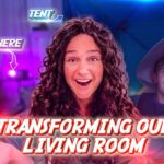 Smiling woman with curly hair in a living room, a child in a hooded cloak, with bold red text 'Transforming Our Living Room' and purple lighting effects.