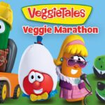 Animated VeggieTales characters pose for a Veggie Marathon banner; includes a cucumber in a hard hat driving a forklift, a white egg character, a singing carrot in sunglasses, and a tall asparagus in a suit with the VeggieTales logo reading ‘VeggieTales Veggie Marathon’