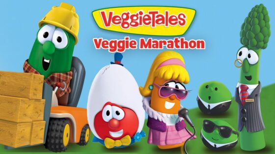 Animated VeggieTales characters pose for a Veggie Marathon banner; includes a cucumber in a hard hat driving a forklift, a white egg character, a singing carrot in sunglasses, and a tall asparagus in a suit with the VeggieTales logo reading ‘VeggieTales Veggie Marathon’