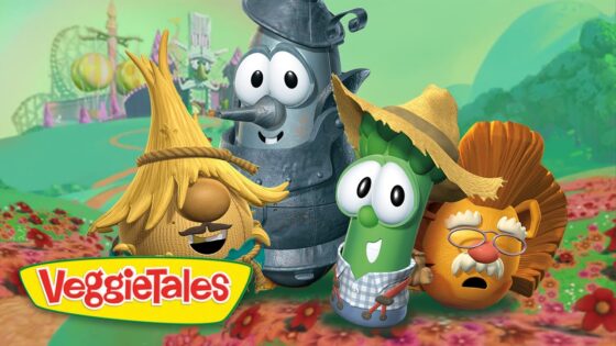 Group of VeggieTales characters posing in a bright, whimsical garden with the VeggieTales logo in the foreground.