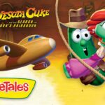 Promo artwork for VeggieTales: Minnesota Cure, featuring a green veggie swinging from a rope with a red-haired companion and a wooden plane against a desert sunset.