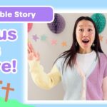 Children's Bible story thumbnail: cheerful woman speaks with pastel cardigan, 'Jesus Is Alive!' text and colorful decorations in the background.