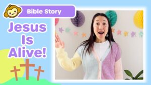 Children's Bible story thumbnail: cheerful woman speaks with pastel cardigan, 'Jesus Is Alive!' text and colorful decorations in the background.