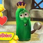 Green veggie character wearing a crown stands with ducklings and heart stickers in a sunny scene; VeggieTales branding shown bottom left.