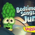 VeggieTales bedtime title card: 'Bedtime Songs with Junior' beside a smiling broccoli character and a teddy bear image.