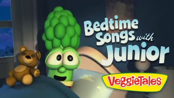 VeggieTales bedtime title card: 'Bedtime Songs with Junior' beside a smiling broccoli character and a teddy bear image.