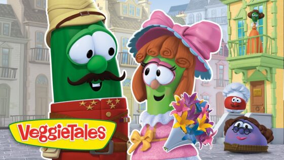 Green veggie character with a hat and mustache smiles at a pink-clad veggie holding a bouquet in a quaint town, VeggieTales logo visible.