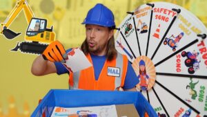Construction worker in safety vest and blue hard hat places a drawing into a blue bin, with a colorful wheel backdrop behind him.