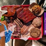 Man in a cowboy hat and blue plaid shirt points excitedly at a red tray of smoked meats (ribs, brisket, turkey) in a BBQ setup with a purple Bar-A-BBQ sign from Montgomery, Texas.