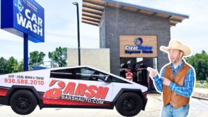 Branded BARSH Auto vehicle in front of ClearWater Express Wash, with a life-sized cowboy cutout pointing at the car.