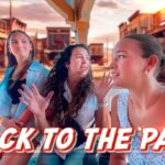 Three women sit on a porch of a western town set; one speaks while two listen, with a bold red 'BACK TO THE PAST' caption across the bottom.
