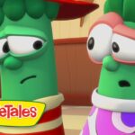 Two VeggieTales vegetables with worried expressions stand indoors; logo reads VeggieTales in the lower-left corner.