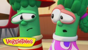 Two VeggieTales vegetables with worried expressions stand indoors; logo reads VeggieTales in the lower-left corner.