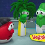 Red tomato character in a space station looks worried while a broccoli and a cucumber in space suits stand nearby.