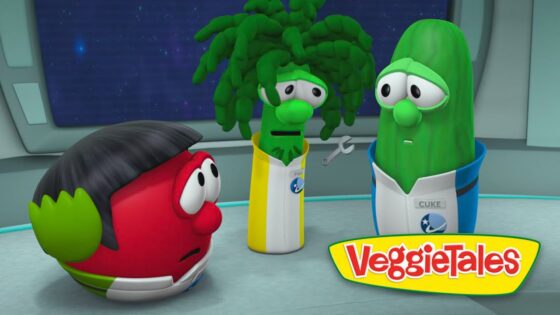 Red tomato character in a space station looks worried while a broccoli and a cucumber in space suits stand nearby.