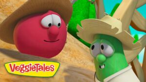 Two VeggieTales characters, a red round veggie with a straw hat and a green cucumber with a large hat, smile at each other in a sunny outdoor scene.