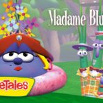 VeggieTales thumbnail: Madame Blueberry in a pink donut ring with a red hat and flowers, beside three green bean characters in plaid outfits in a forest.