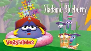 VeggieTales thumbnail: Madame Blueberry in a pink donut ring with a red hat and flowers, beside three green bean characters in plaid outfits in a forest.