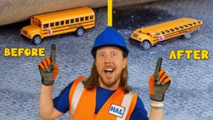 Construction worker in a blue hard hat and orange safety vest points upward with 'Before' and 'After' school buses in the background on a gravel surface.