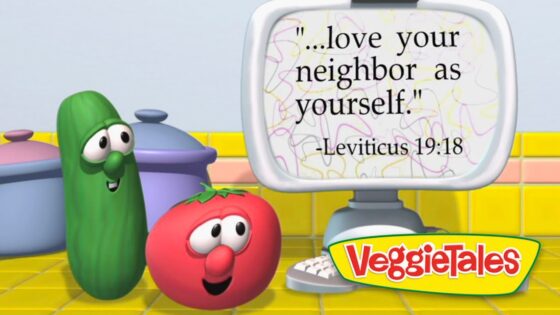 VeggieTales cucumber and tomato look at a computer screen displaying 'Love your neighbor as yourself' (Lev. 19:18).