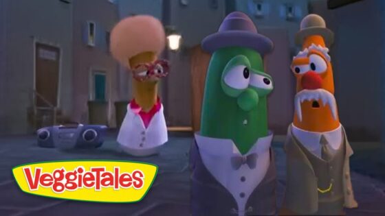 Three VeggieTales characters in tuxedos stand in a dim alley at night, with a boombox on the ground nearby.