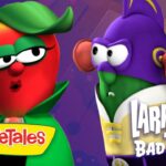 Promo image showing a red VeggieTales tomato character with a green cape and LarryBoy from 'LarryBoy and the Bad Apple' against a purple background, with the VeggieTales logo visible.
