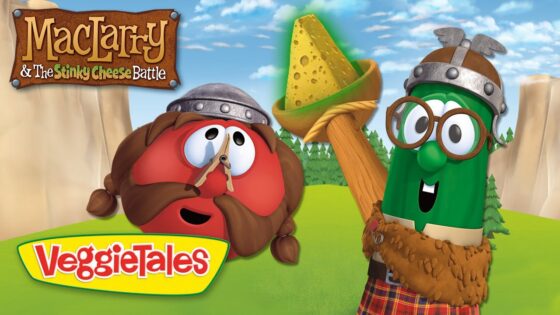 VeggieTales thumbnail: a red veggie with a mustache and helmet next to a green veggie wearing glasses, holding a cheese wedge on a stick in a sunny field, with 'MacTarry & The Stinky Cheese Battle' title.