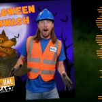 Promotional image for Halloween Carwash featuring a man in an orange safety vest and blue hard hat posing in front of a purple poster with a monster truck illustration and the title 'HALLOWEEN CARWASH'.