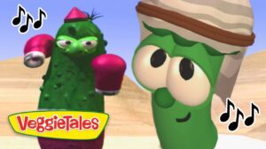 Two green VeggieTales characters wearing boxing gloves boxing in a desert setting, with the VeggieTales logo in the foreground.