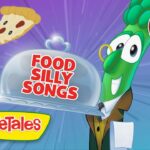 Animated VeggieTales thumbnail: a green vegetable waiter holds a cloche labeled 'Food Silly Songs' with pizza slice, taco/hat, and a drumstick around; '40 mins' badge in the corner.