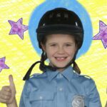 Smiling girl in police uniform and helmet giving two thumbs up, colorful doodle background with purple stars.