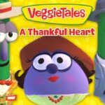 VeggieTales cover art: a purple central character with two green veggie friends in hats against a yellow background with the title 'A Thankful Heart'