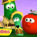 Three VeggieTales characters—a cucumber, broccoli, and tomato—stand on a grassy stage with a purple sky. VeggieTales logo is bottom left.