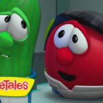 Two VeggieTales characters—a green cucumber and a red tomato—talk in a futuristic spaceship cockpit with the VeggieTales logo visible.
