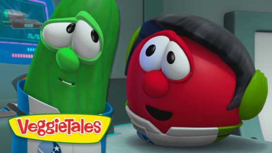 Two VeggieTales characters—a green cucumber and a red tomato—talk in a futuristic spaceship cockpit with the VeggieTales logo visible.