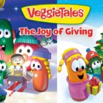 VeggieTales: The Joy of Giving poster with a group of anthropomorphic vegetables in a snowy holiday scene, gathered around gifts.
